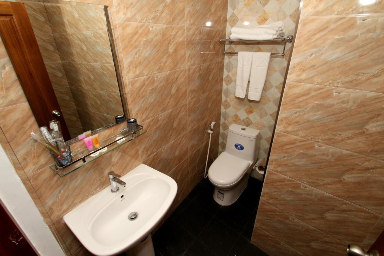 Gemsy Hotel Yangon Chambre photo